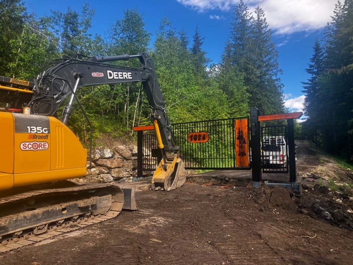 Motorized vehicle access gate for residential property under construction.