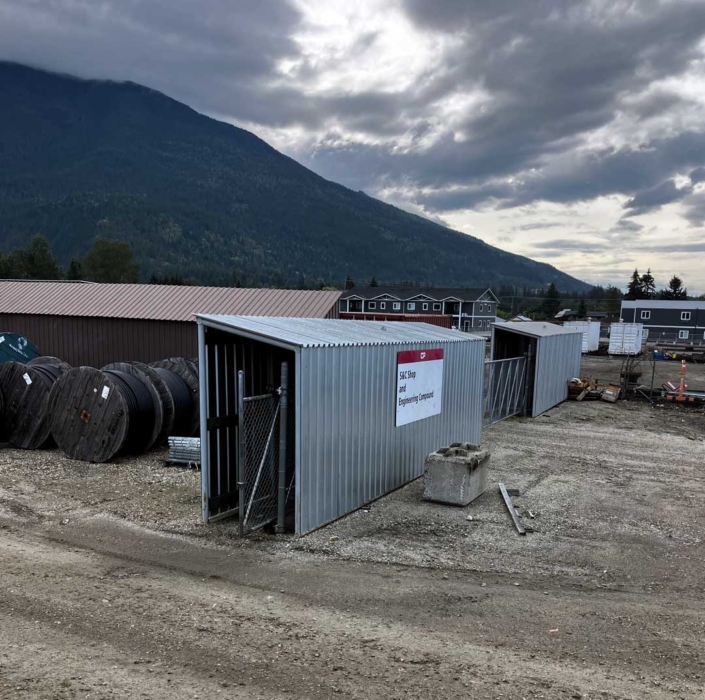 Covered storage structure for cantilever gate at busy rail yard.